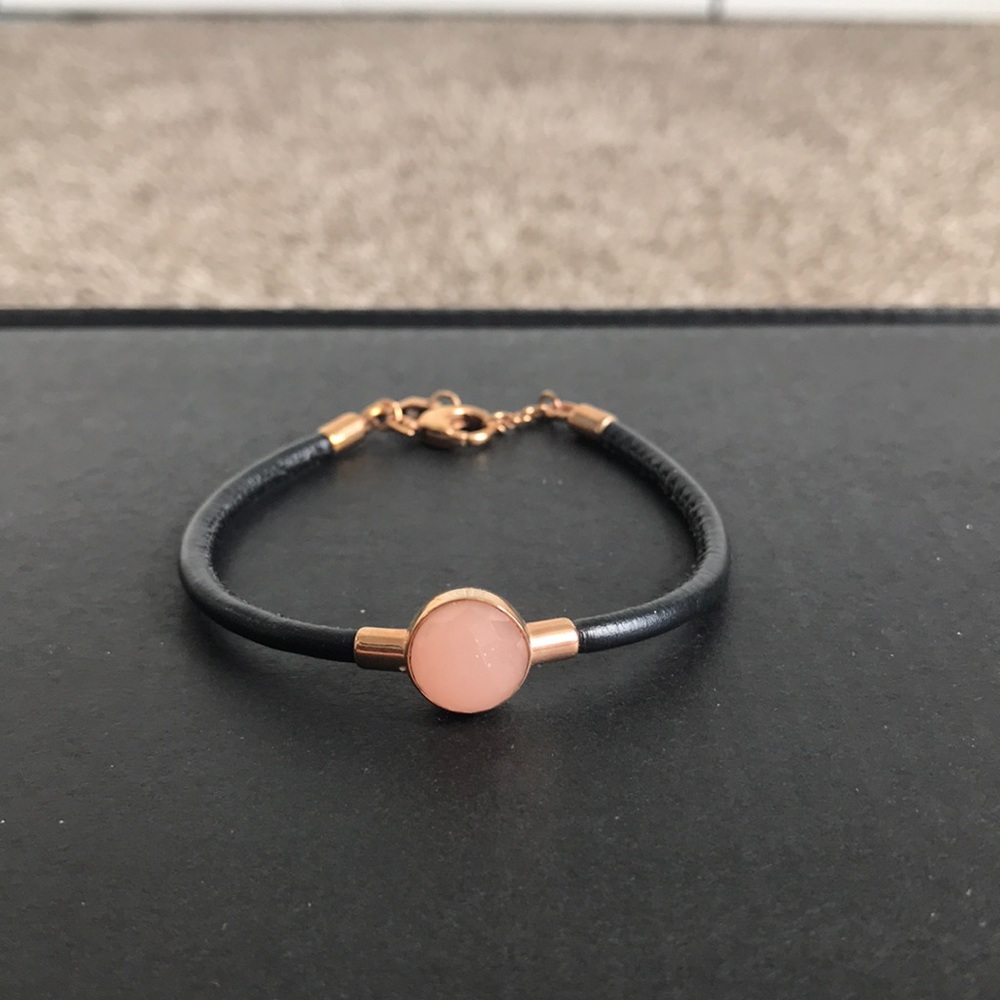 Fossil bracelet. Black leather band, rose gold hardware, pink center stone